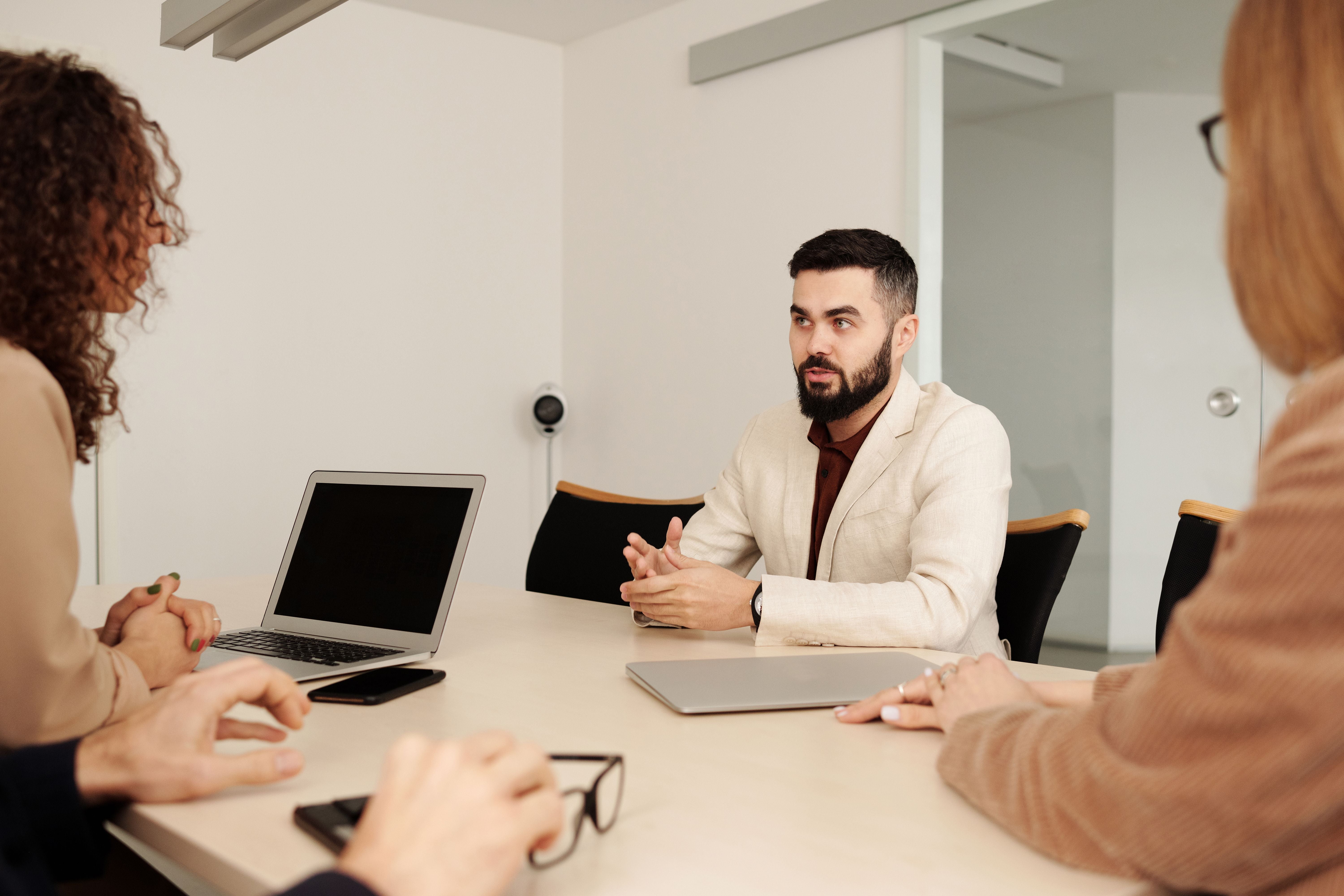 Business team collaborating around a laptop in a planning session