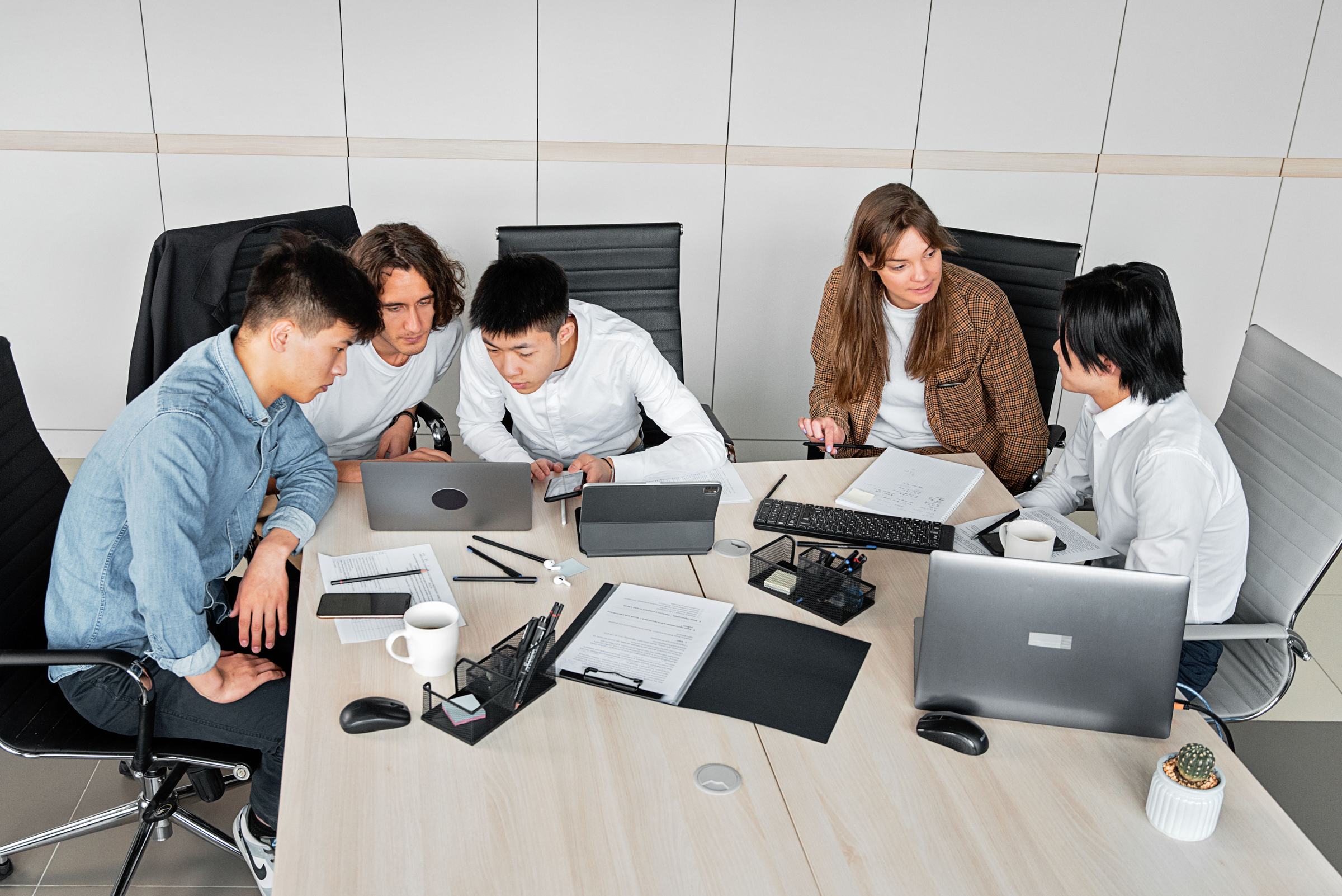 Office team laptop discussion (alt)